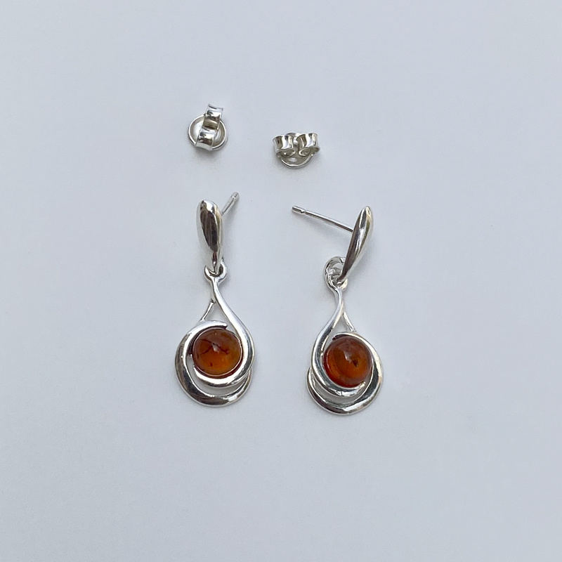 Silver earring with amber.