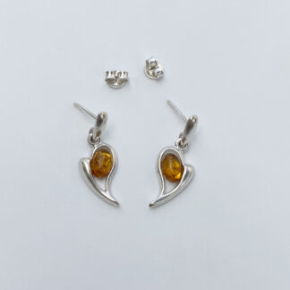 Silver earring with amber.